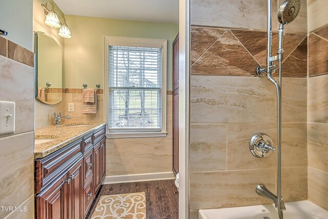216 Forest Hills Dr, Bristol, TN 37620 - bathroom with a sink, baseboards, double vanity, and wood finished floors