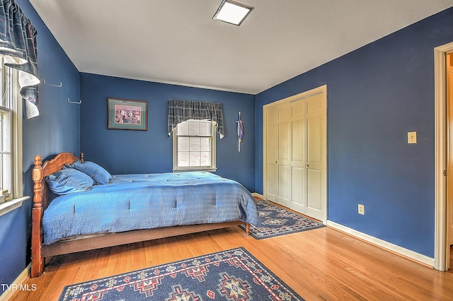 216 Forest Hills Dr, Bristol, TN 37620 - bedroom featuring a closet, baseboards, and wood finished floors