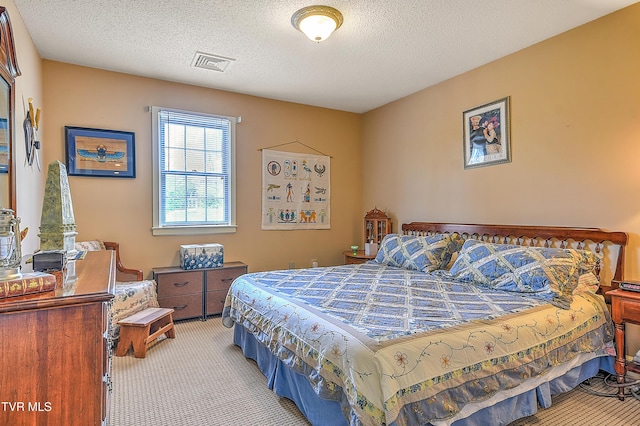 216 Forest Hills Dr, Bristol, TN 37620 - bedroom featuring visible vents, light carpet, and a textured ceiling