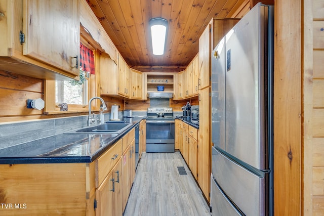 kitchen featuring open shelves, a sink, dark countertops, under cabinet range hood, and stainless steel appliances