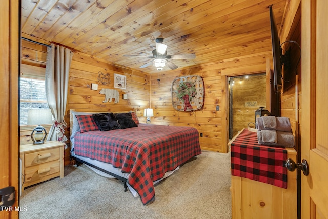 bedroom featuring wooden walls, a ceiling fan, carpet flooring, and wood ceiling