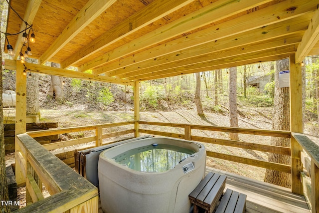 view of pool with a hot tub