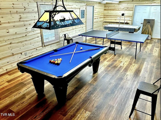recreation room with wooden walls, billiards, wood finished floors, and electric panel