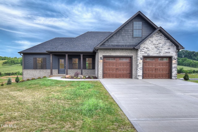 2442 Haystack Cir, Piney Flats, TN 37686 - craftsman inspired home with driveway, a garage, a front yard, board and batten siding, and stone siding