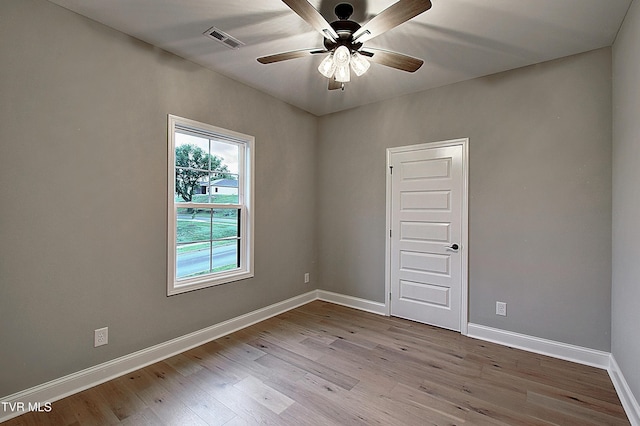 2442 Haystack Cir, Piney Flats, TN 37686 - spare room featuring wood finished floors, baseboards, and ceiling fan