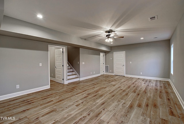 2442 Haystack Cir, Piney Flats, TN 37686 - empty room featuring stairway, light wood-type flooring, ceiling fan, baseboards, and recessed lighting