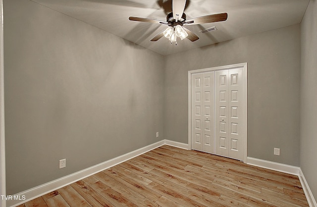 2442 Haystack Cir, Piney Flats, TN 37686 - spare room featuring ceiling fan, light wood-style flooring, and baseboards
