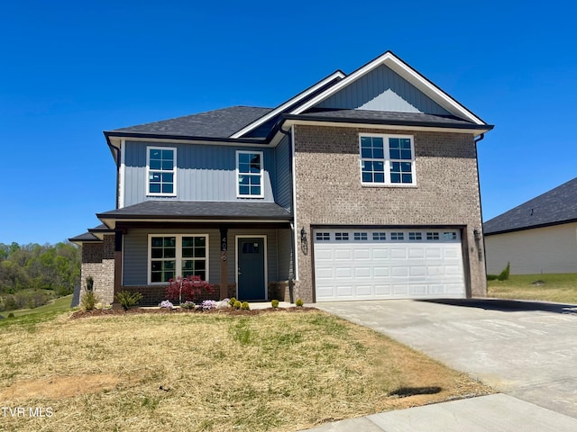 4076 Maize Pl, Piney Flats, TN 37686 - view of front of home with an attached garage, brick siding, driveway, a front yard, and a porch