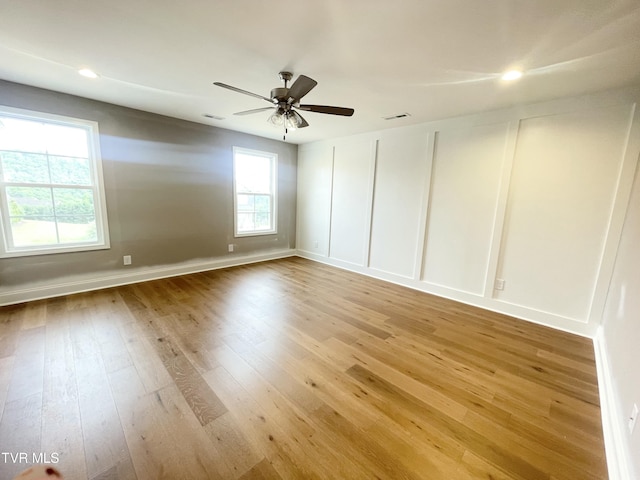 4076 Maize Pl, Piney Flats, TN 37686 - empty room with light wood finished floors, ceiling fan, baseboards, and recessed lighting