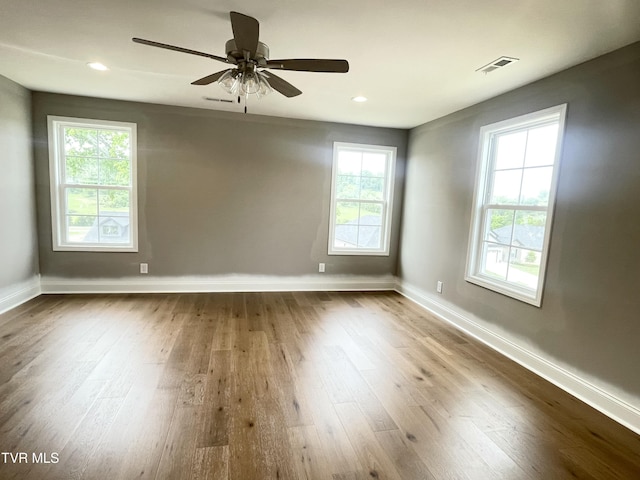 4076 Maize Pl, Piney Flats, TN 37686 - empty room with healthy amount of natural light, dark wood finished floors, baseboards, and recessed lighting