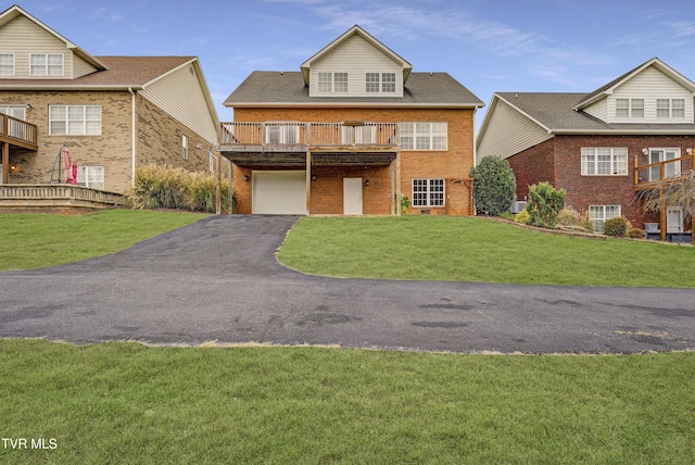 798 Hamilton Rd, Blountville, TN 37617 - view of front facade with brick siding, asphalt driveway, a front lawn, and an attached garage