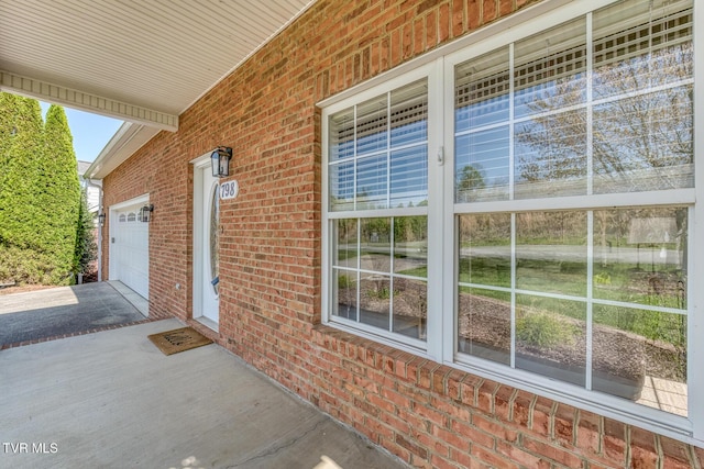 798 Hamilton Rd, Blountville, TN 37617 - view of home's exterior with driveway, a garage, brick siding, and a porch