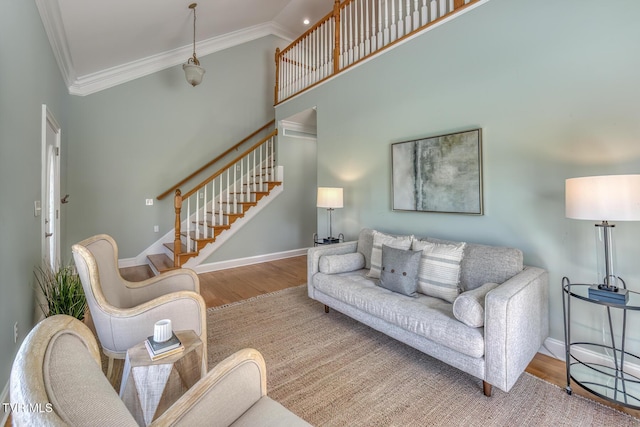 798 Hamilton Rd, Blountville, TN 37617 - living area with ornamental molding, wood finished floors, stairway, baseboards, and a towering ceiling
