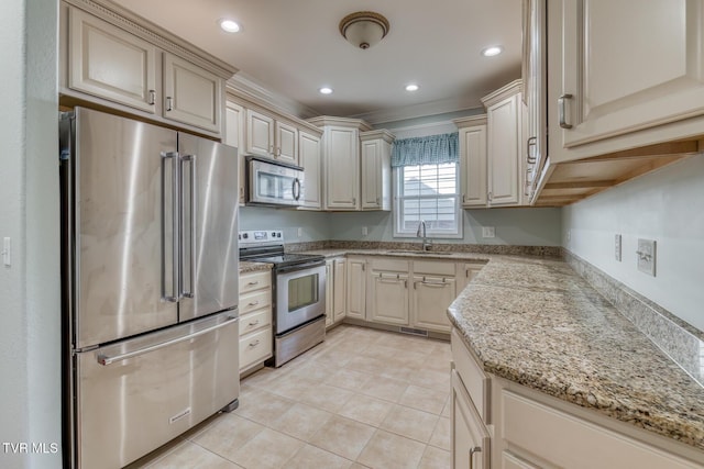 798 Hamilton Rd, Blountville, TN 37617 - kitchen featuring appliances with stainless steel finishes, a sink, cream cabinets, and recessed lighting