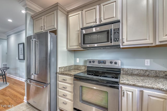 798 Hamilton Rd, Blountville, TN 37617 - kitchen with appliances with stainless steel finishes, crown molding, light stone countertops, and recessed lighting