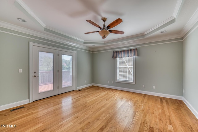 798 Hamilton Rd, Blountville, TN 37617 - empty room featuring healthy amount of natural light, crown molding, light wood finished floors, a tray ceiling, and ceiling fan