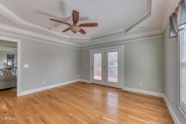 798 Hamilton Rd, Blountville, TN 37617 - spare room featuring a ceiling fan, light wood-style floors, crown molding, baseboards, and a raised ceiling