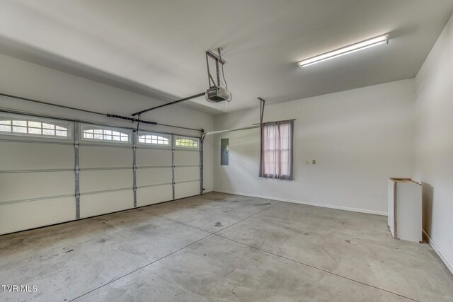 798 Hamilton Rd, Blountville, TN 37617 - garage with a garage door opener, baseboards, and electric panel