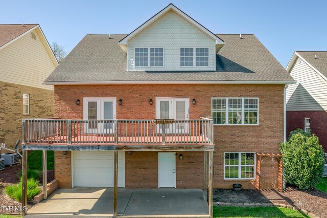 798 Hamilton Rd, Blountville, TN 37617 - rear view of property with brick siding, a garage, and french doors