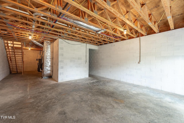 unfinished basement featuring water heater