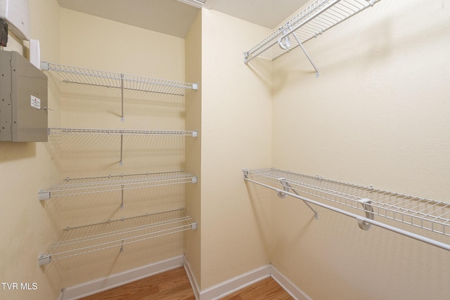 spacious closet with wood finished floors