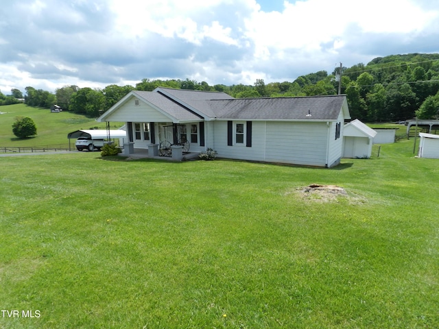 14930 Kingsport Hwy, Chuckey, TN 37641 - view of front of house with a shingled roof, fence, a front yard, and a carport