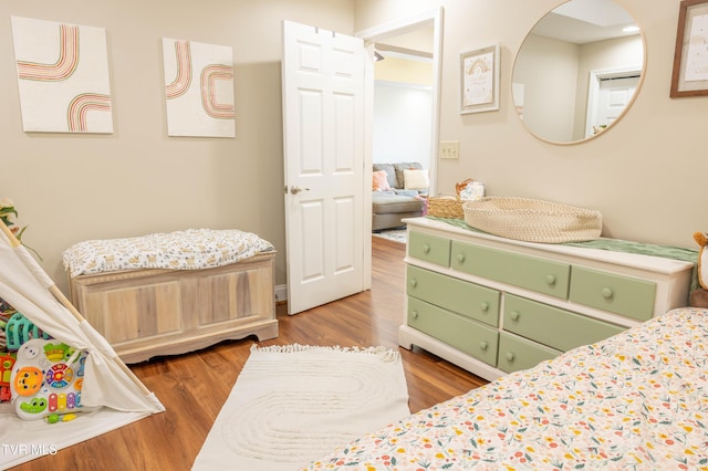 bedroom with wood finished floors