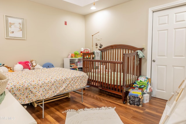 bedroom featuring wood finished floors and recessed lighting
