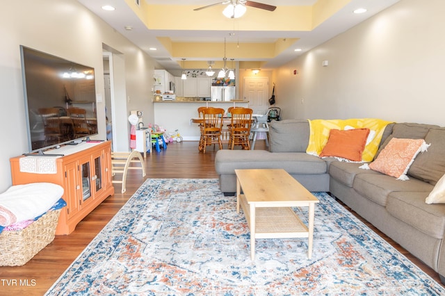 living room featuring a ceiling fan, wood finished floors, and recessed lighting