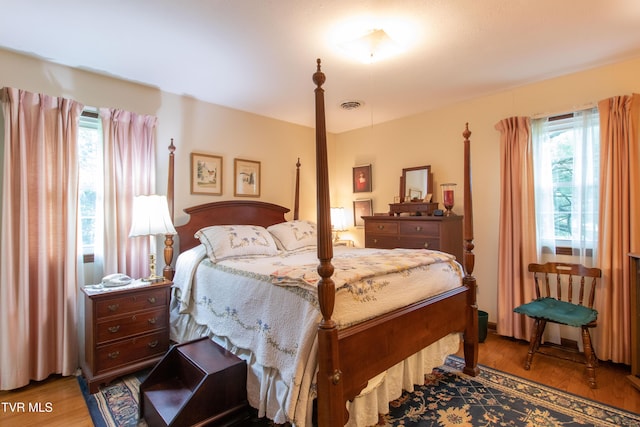 19494 Oakwood Dr, Abingdon, VA 24211 - bedroom with multiple windows and wood finished floors