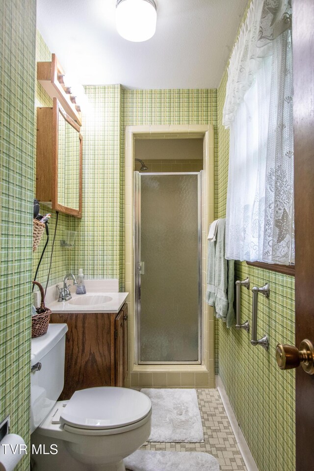19494 Oakwood Dr, Abingdon, VA 24211 - bathroom with wallpapered walls, a stall shower, toilet, and vanity