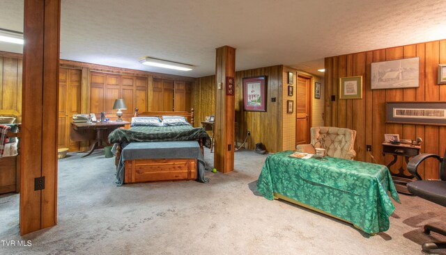 19494 Oakwood Dr, Abingdon, VA 24211 - carpeted bedroom with wooden walls and a textured ceiling