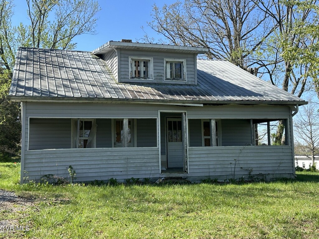520 Mohawk Creek Rd, Midway, TN 37809 - view of front facade with covered porch, a front lawn, and metal roof
