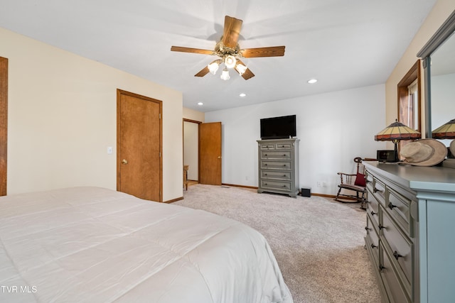 bedroom with baseboards, recessed lighting, light colored carpet, and a ceiling fan