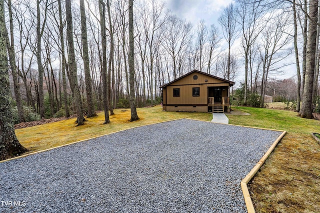 view of front of house with a front yard, a porch, and crawl space