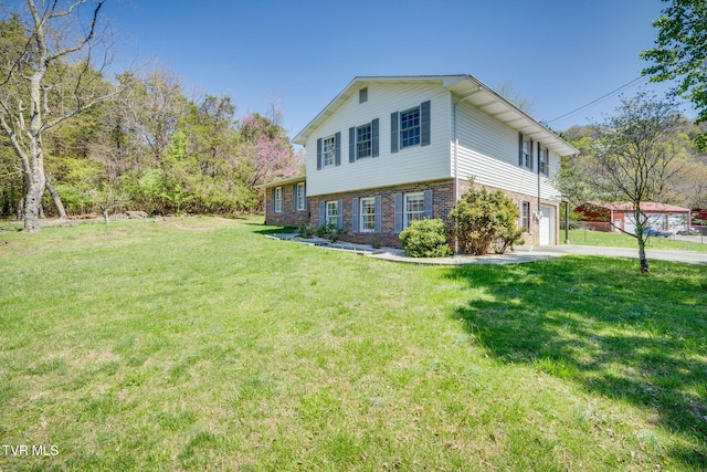 view of home's exterior with an attached garage, a yard, concrete driveway, and brick siding