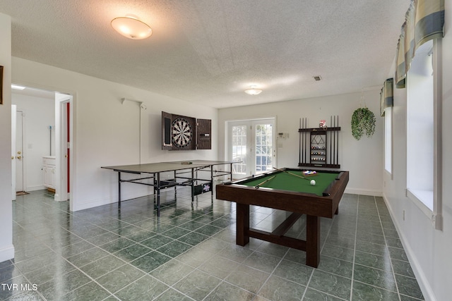rec room featuring baseboards, a textured ceiling, billiards, french doors, and tile patterned floors