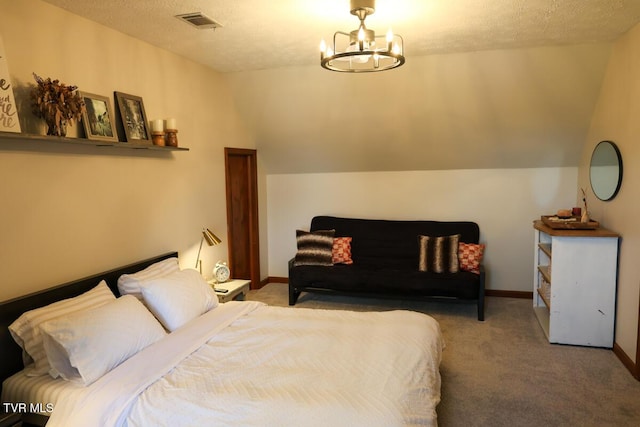 bedroom featuring visible vents, baseboards, an inviting chandelier, a textured ceiling, and carpet flooring
