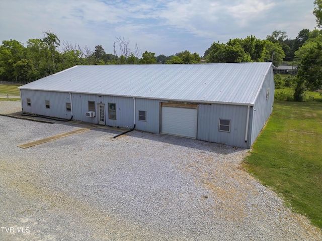 90 Darnell Rd, Greeneville, TN 37743 - view of front facade featuring a garage, cooling unit, an outbuilding, a front lawn, and driveway