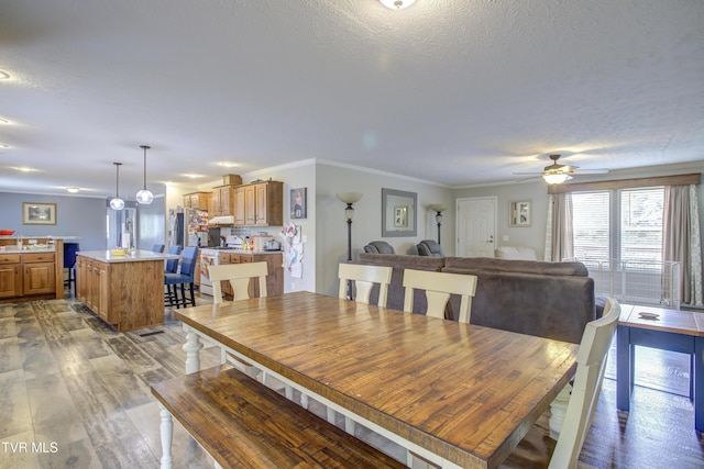 90 Darnell Rd, Greeneville, TN 37743 - dining area with light wood-style flooring, a textured ceiling, a ceiling fan, and ornamental molding