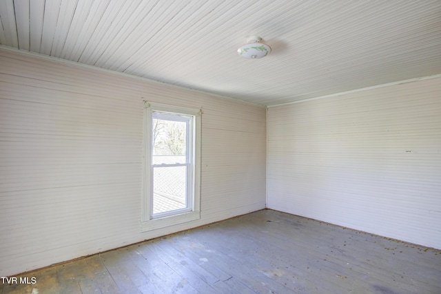 spare room with hardwood / wood-style floors