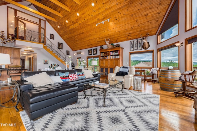589 Harbor Point Rd, Butler, TN 37640 - living area with high vaulted ceiling, light wood-style flooring, wood ceiling, and beam ceiling