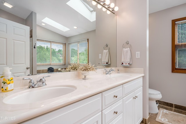 589 Harbor Point Rd, Butler, TN 37640 - full bath with a skylight, double vanity, toilet, lofted ceiling, and recessed lighting