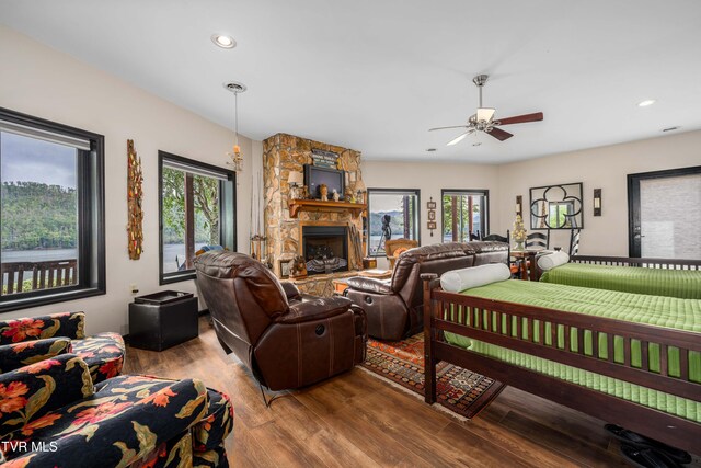 589 Harbor Point Rd, Butler, TN 37640 - living room featuring plenty of natural light, a fireplace, wood finished floors, a ceiling fan, and recessed lighting