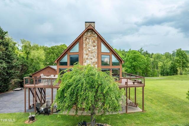 589 Harbor Point Rd, Butler, TN 37640 - back of property featuring a wooden deck, stairway, a chimney, and a lawn