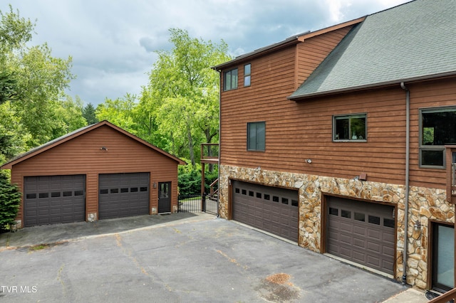 589 Harbor Point Rd, Butler, TN 37640 - view of side of property with stone siding and a shingled roof