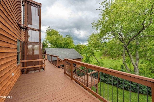 589 Harbor Point Rd, Butler, TN 37640 - wooden terrace featuring a lawn and view of scattered trees