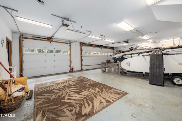 589 Harbor Point Rd, Butler, TN 37640 - garage featuring oil tank and a garage door opener