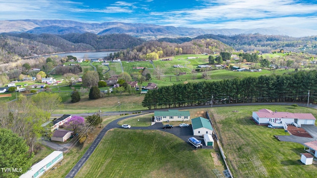 aerial view featuring a water and mountain view