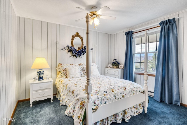 bedroom featuring crown molding, ceiling fan, dark carpet, a textured ceiling, and baseboard heating